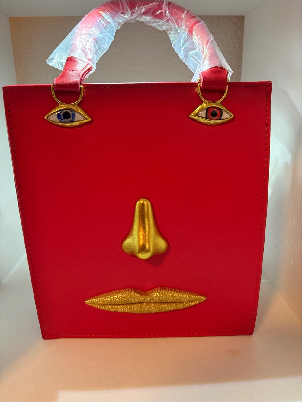 Red Novelty Face-Accent Tote Bag with Gold Details